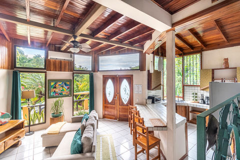 Guests relaxing by the pool at Hotel Las Cascadas in Manuel Antonio, Costa Rica.