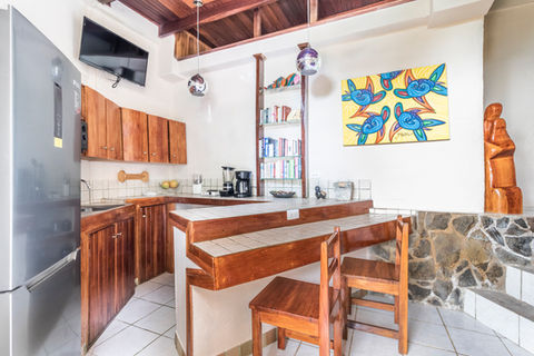Bougainvillea Suite fully equipped kitchen and dining area at Boutique Hotel Las Cascadas Costa Rica