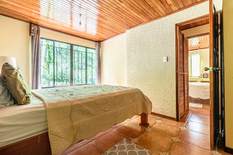 Third bedroom with queen bed, garden view and tropical decor at Casa Cascadas family vacation rental, Boutique Hotel Las Cascadas, Manuel Antonio, Costa Rica