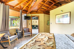 Guests enjoying signature cocktails at the boutique hotel bar in Quepos.