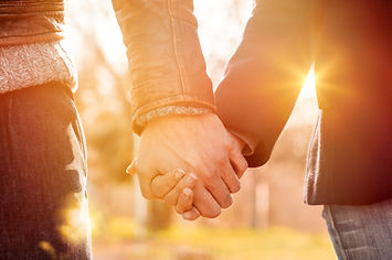 Two recovering alcoholics holding hands