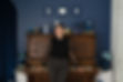 in front of piano smiling wide.jpg
