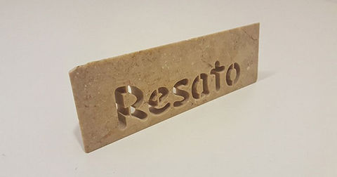 Stone with Resato logo cut with a waterjet cutting machine.jpg