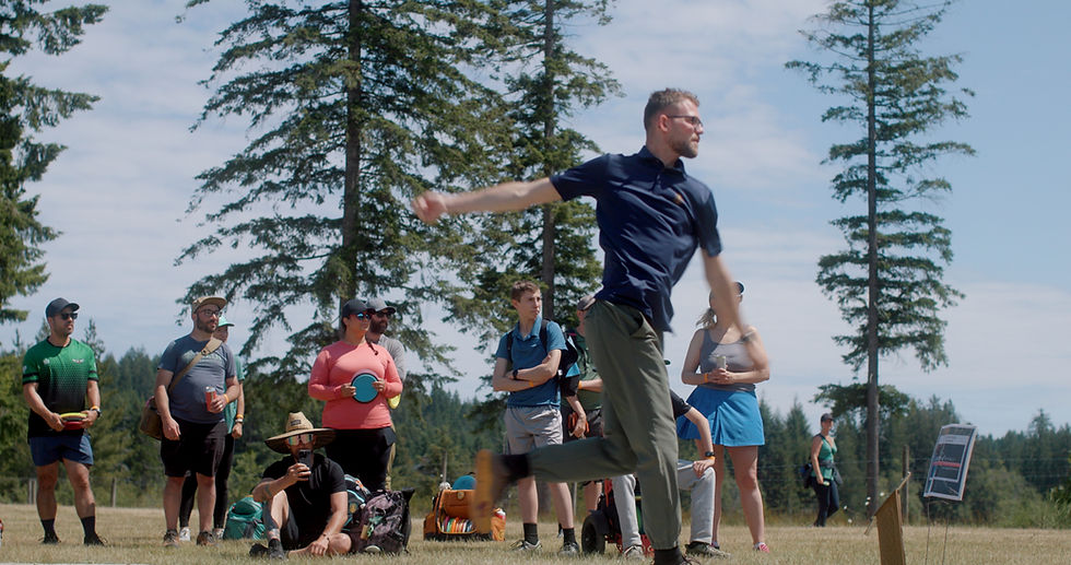 Thomas Gilbert playing disc golf at Smith Lake Farm