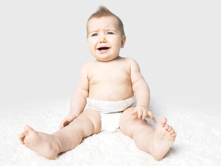 How did the baby tell her mom that she had a wet diaper?