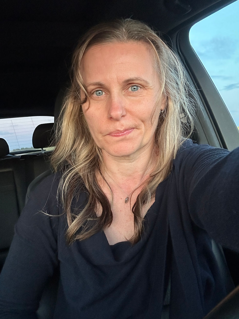 Anita Elliott sitting in her car, looking directly at the camera with a gentle expression, introducing her blog post about visibility and vulnerability.