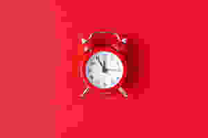 A clock showing that a woman's period is late.
