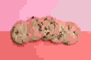 Delicious Chocolate Chip Cookies on pink and red background