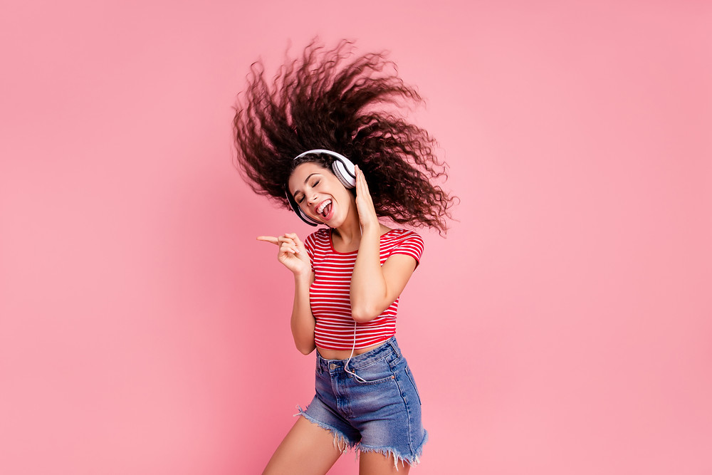 Pretty girl listening to music when she is on her period