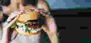 Girl holding a big hamburger