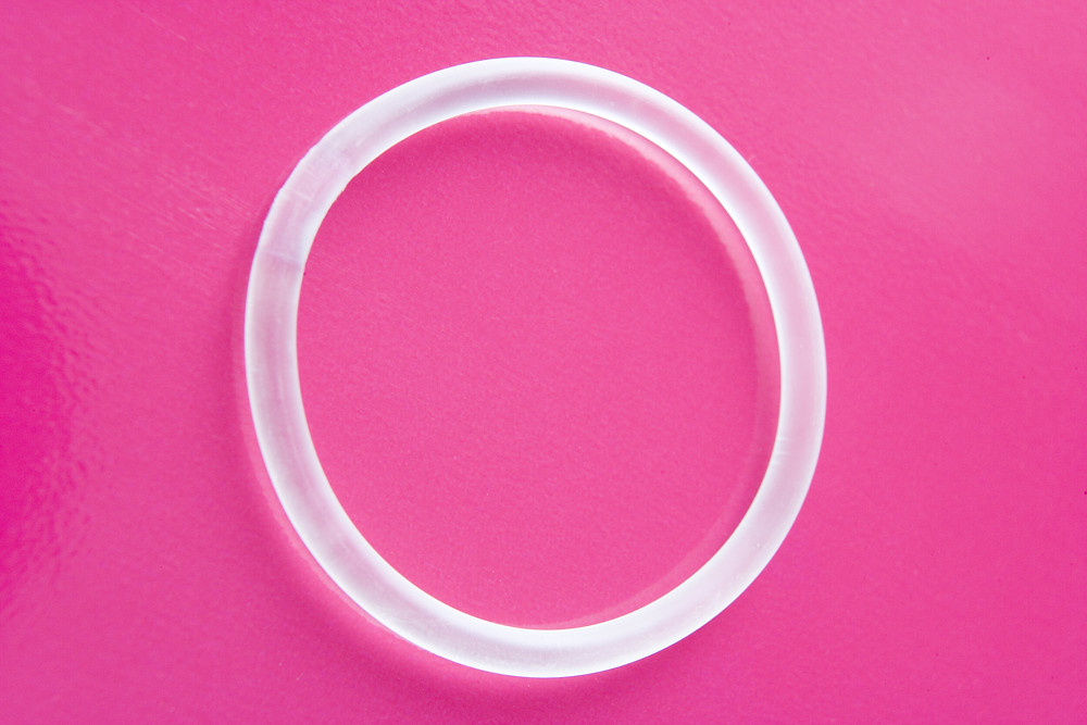 Vaginal ring on a pink background