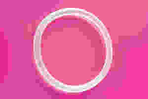 Vaginal ring on a pink background