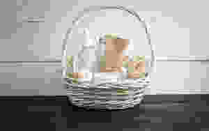white wicker basket with supplies in it