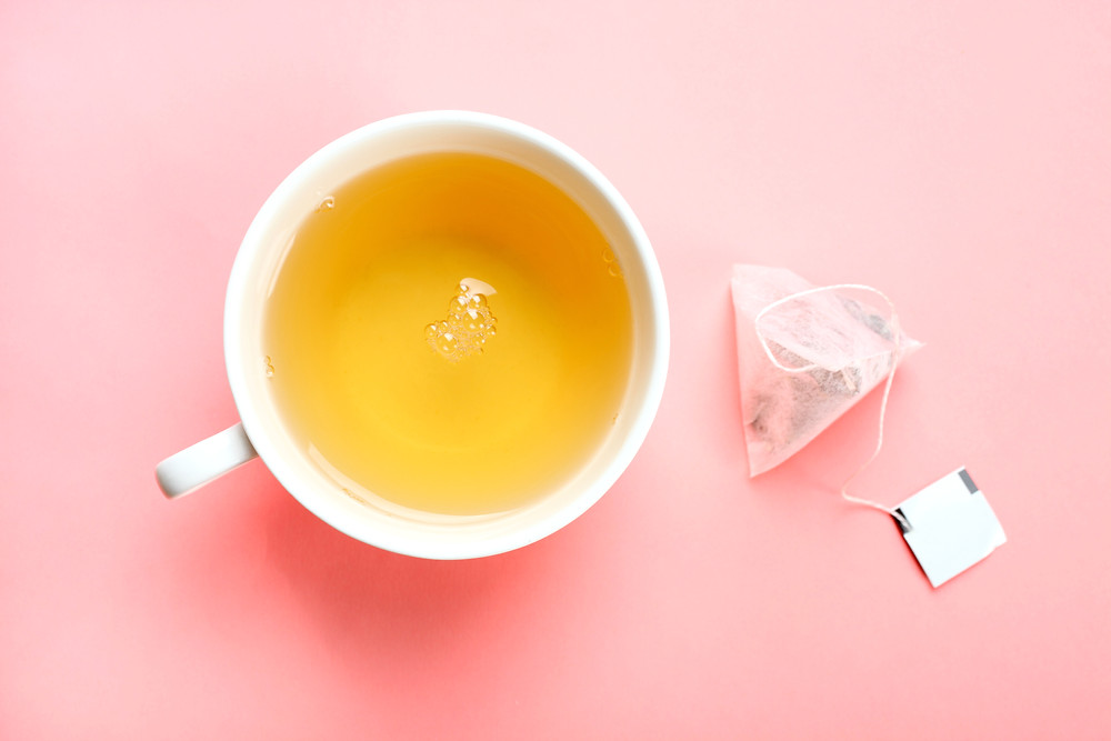 Plain tea on a pink background