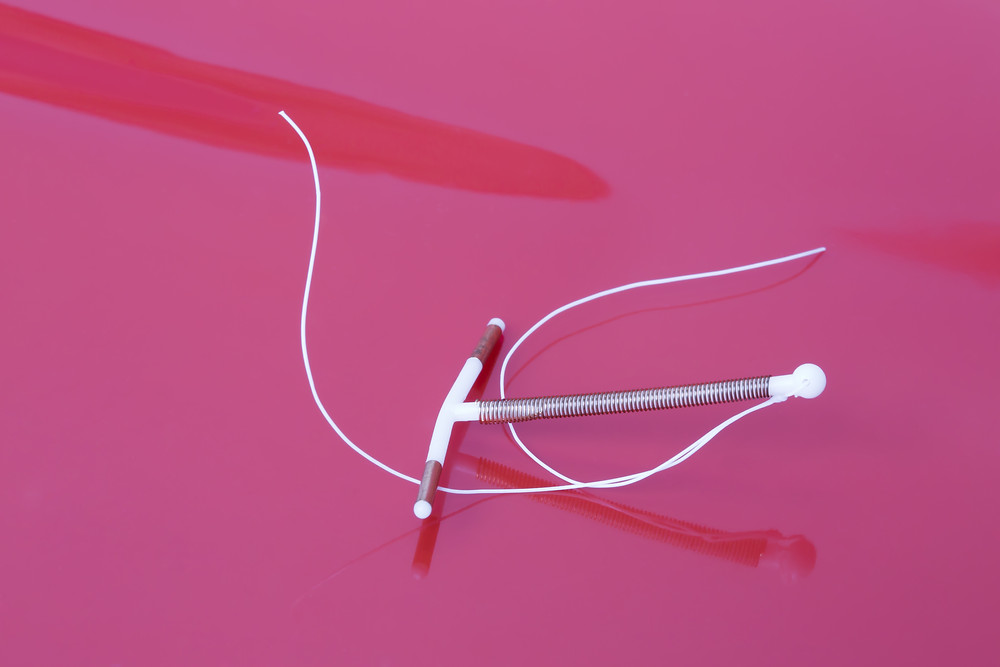 IUD on pink background