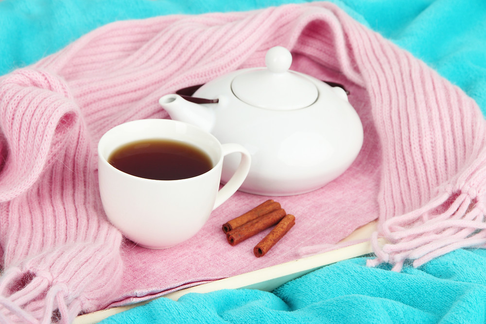 Cinnamon tea on a pink scarf
