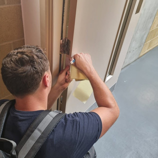 A member of R2R carrying out a Fire Door survey