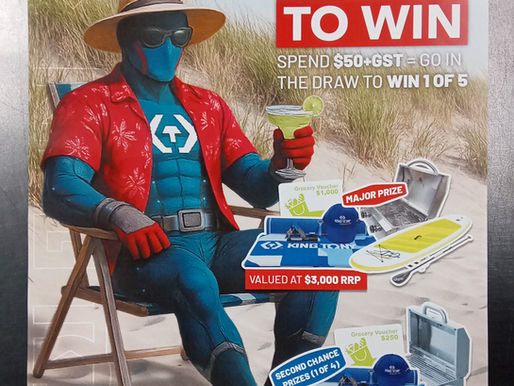 King Tony on beach with prizes