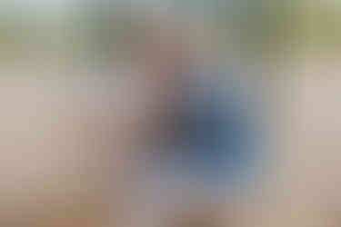 older couple kissing on swings