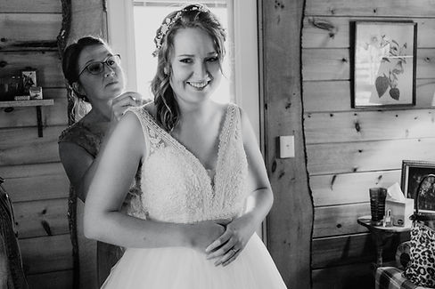 Black and white photo of a bride getting ready