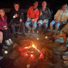 Perspektiv team enjoying s'mores