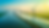 Wind turbines along a river at sunrise
