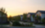 image of a new suburb with modern style new houses with some green trees sorrounding the a