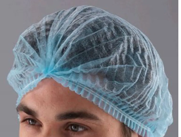 Person wearing blue hairnet
