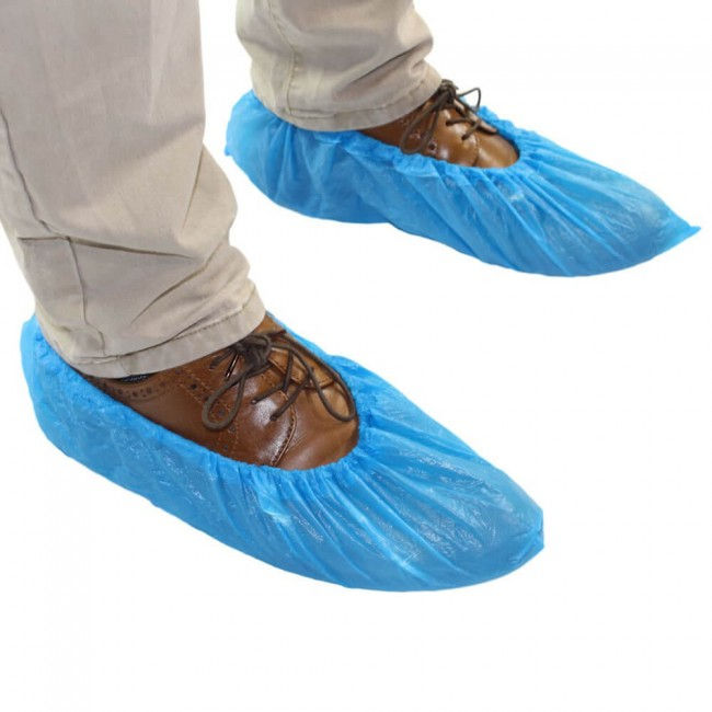 Person wearing blue disposable shoe covers