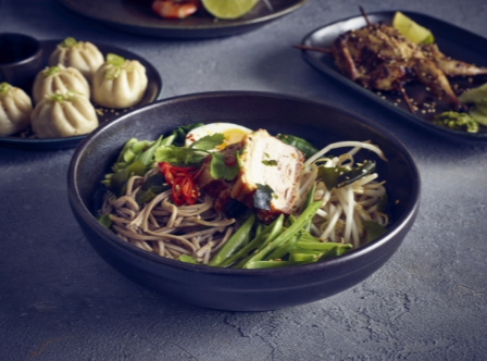 Terra porcelain black coupe bowl with food in it