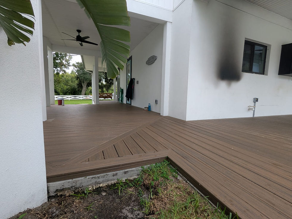 Wrap around porch installed with composite decking. View 2