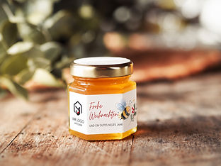 Personalisiertes Weihnachtsgeschenk mit Honig, Firmenlogo und weihnachtlichem Bienenmotiv