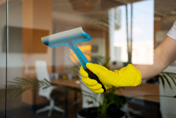 professional-cleaning-service-person-cleaning-office-window.jpg