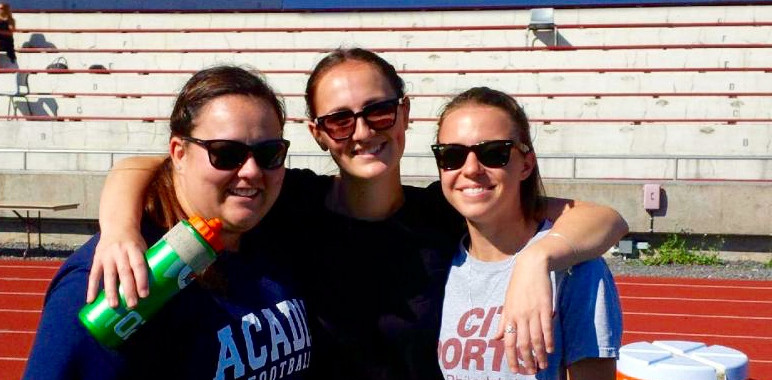 Athletic Therapist & Students - three people, all wearing sunglasses standing close together