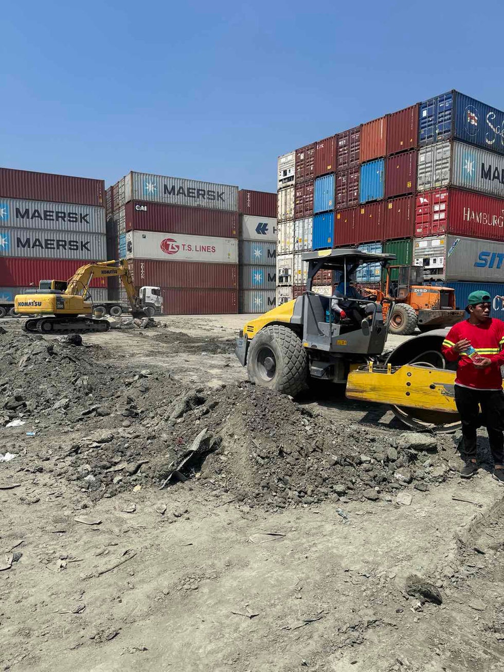 Heavy machinery operating at an AA2000 shipping yard.