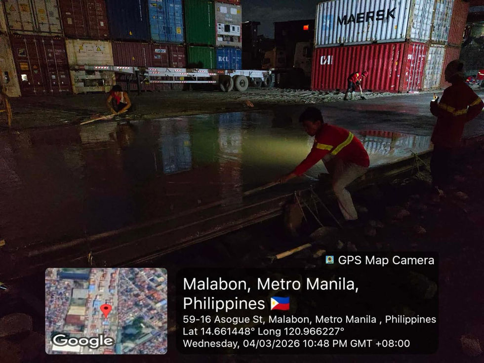 Workers at a shipping yard in Malabon, Metro Manila.