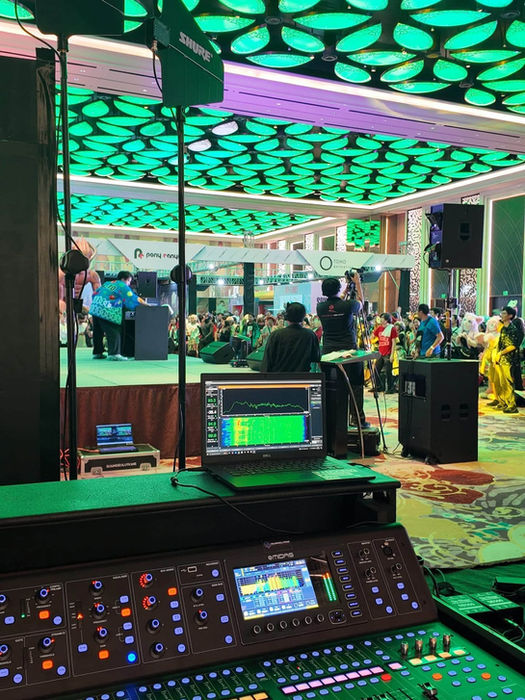 Professional sound mixing console at a live event hall