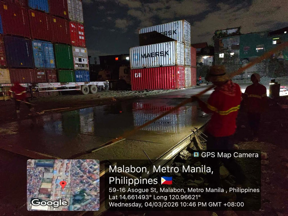Workers at a shipping terminal in Malabon, Metro Manila.