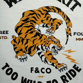Tiger motif with typography in water-based screen printing – bright orange and black on light-colored fabric