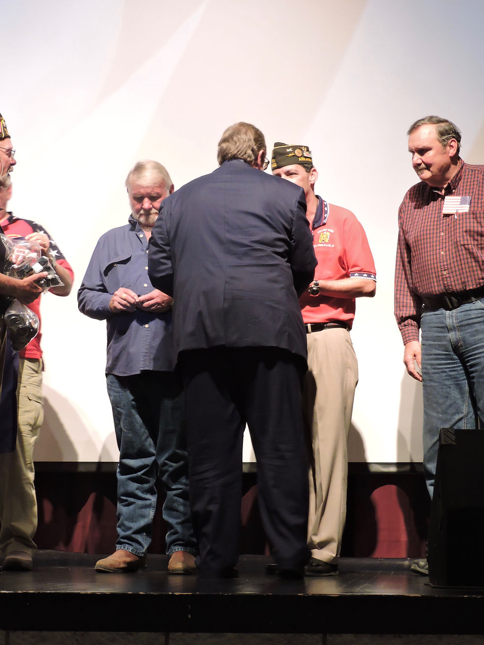 Vietnam Era Veterans receiving a pin