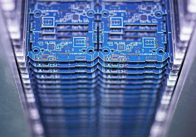 blue electronic PCB boards assembled at an SMT factory and put together in a rack.jpg