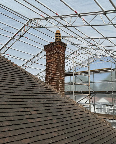 Weatherproof temporary roof scaffolding covering a house roof in Nottingham