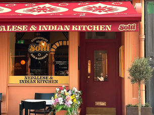 A picture of Solti frontage. Decor is peach and red