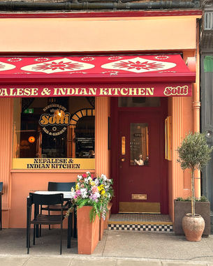 A picture of Solti frontage. Decor is peach and red