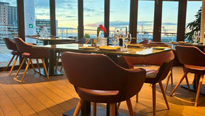 The Dining room in the bow of the boat looking across the Port of Leith