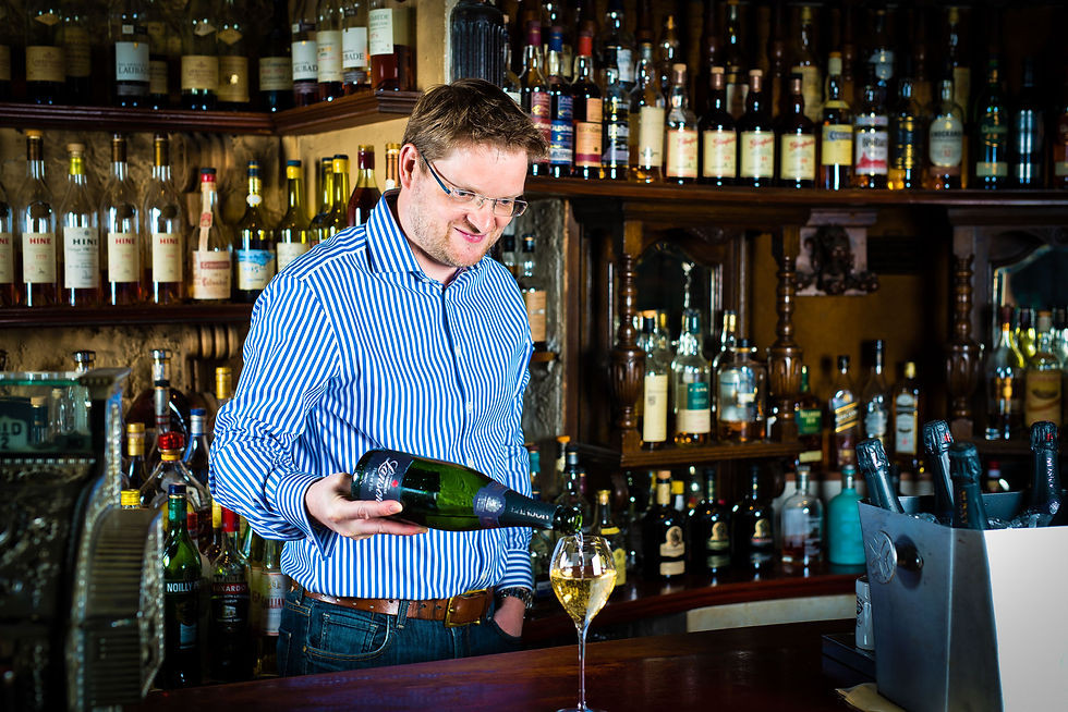 Jason from Champnay Inn pouring wine