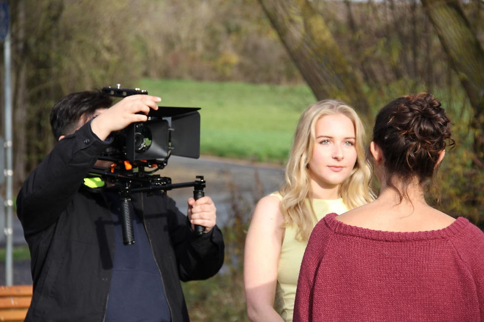 Eye-level view of a film set with equipment and lighting