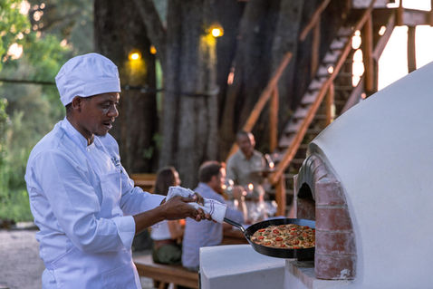 Maxa's central cooking area features a pizza oven!