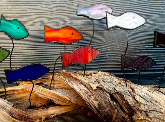 Glass fish on wood