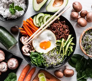 traditional-korean-dish-bibimbap-with-chopsticks-free-photo.webp